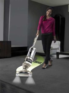Woman using the Shark Rotator Lift-Away in Cleaning Carpet